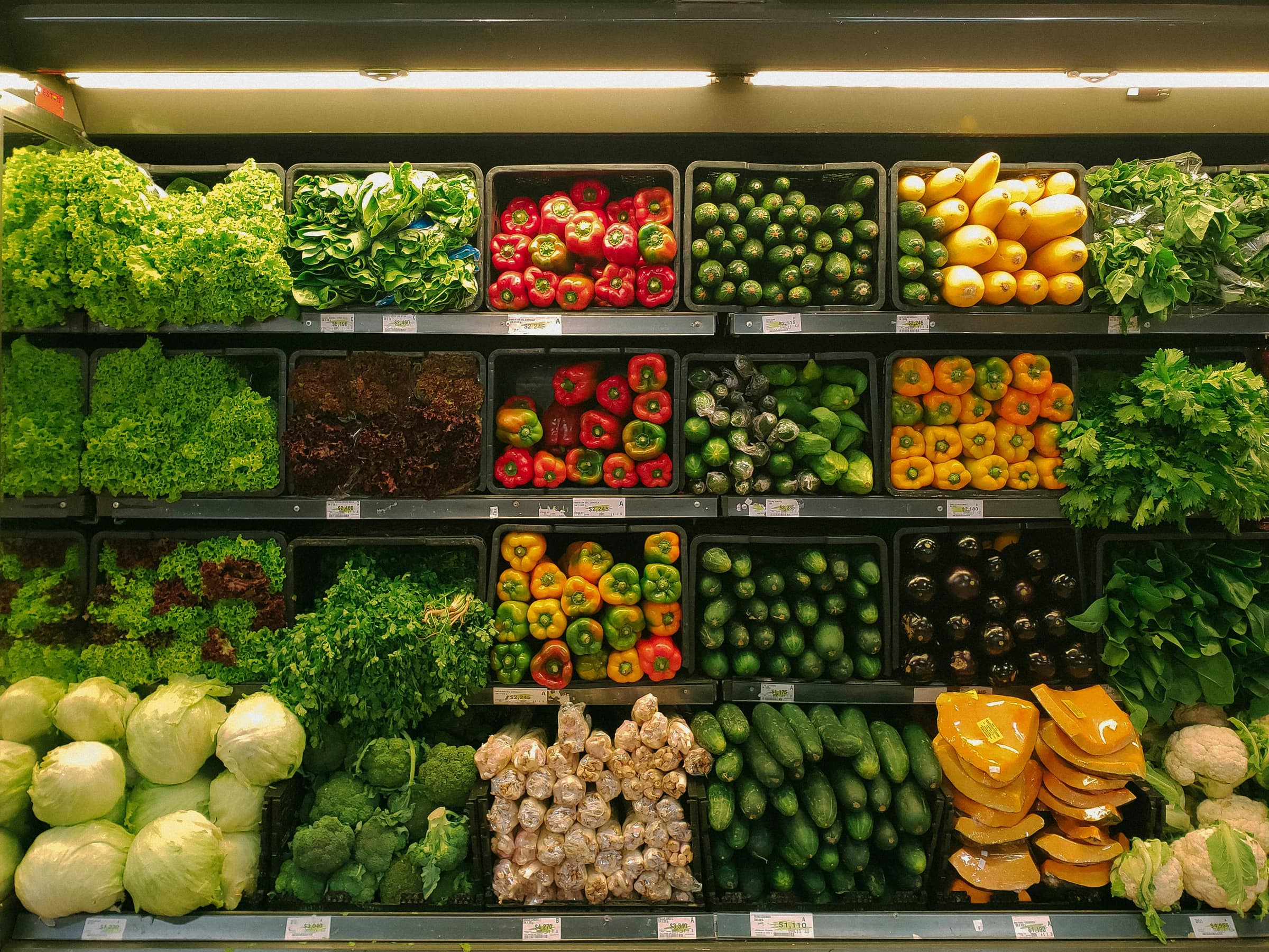 Grocery produce wall stocked with vegetables