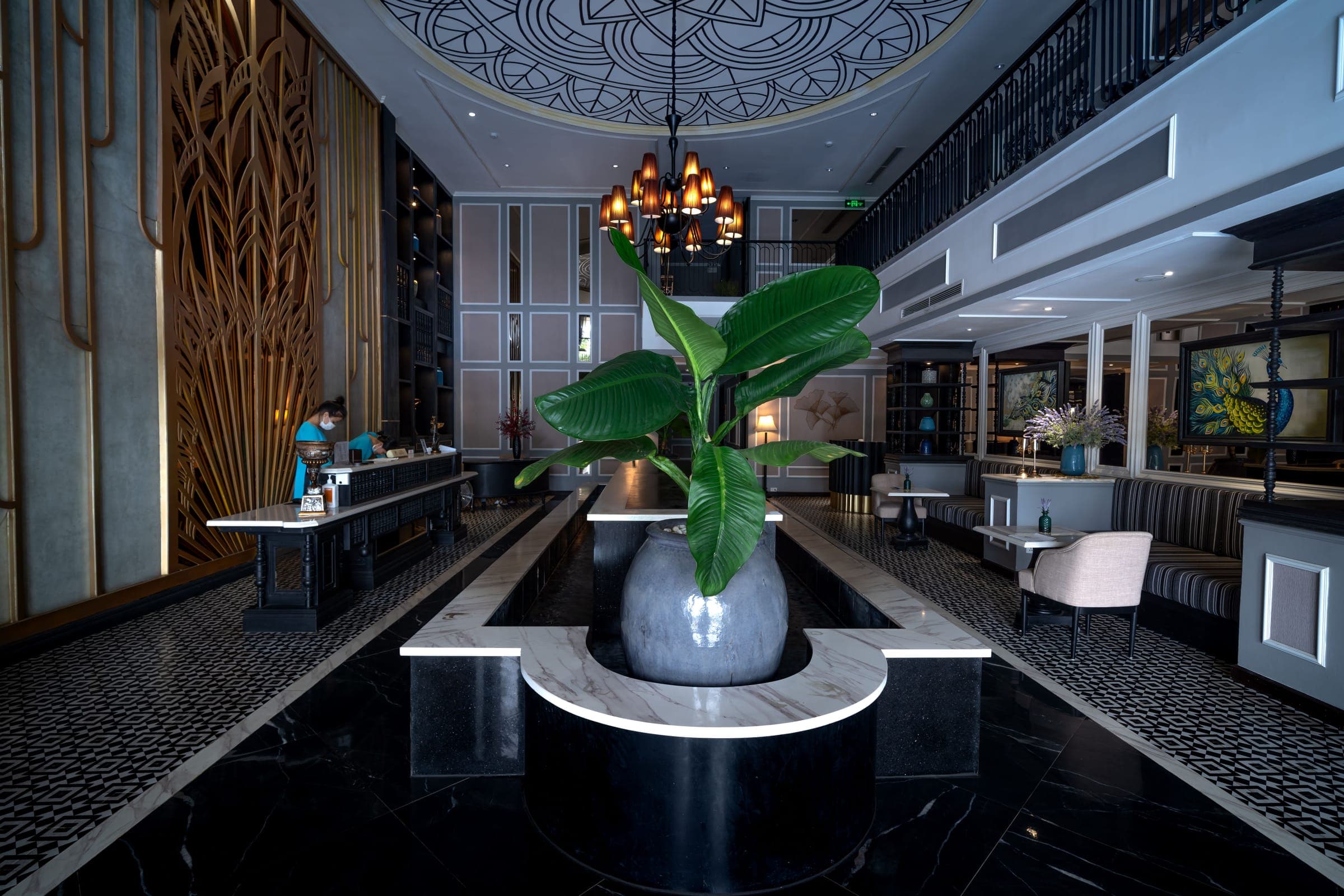 Dark marble hotel lobby with a reception desk