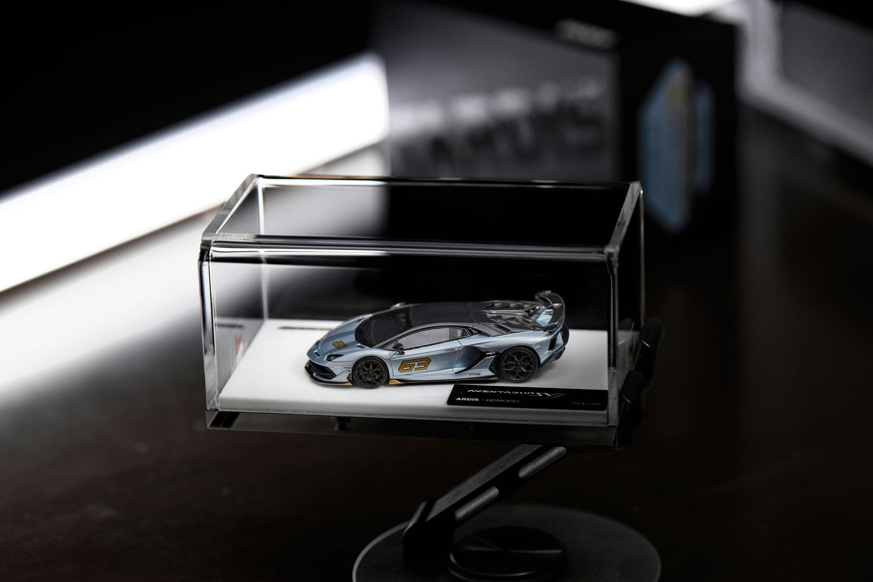 Model car displayed in a clear acrylic case