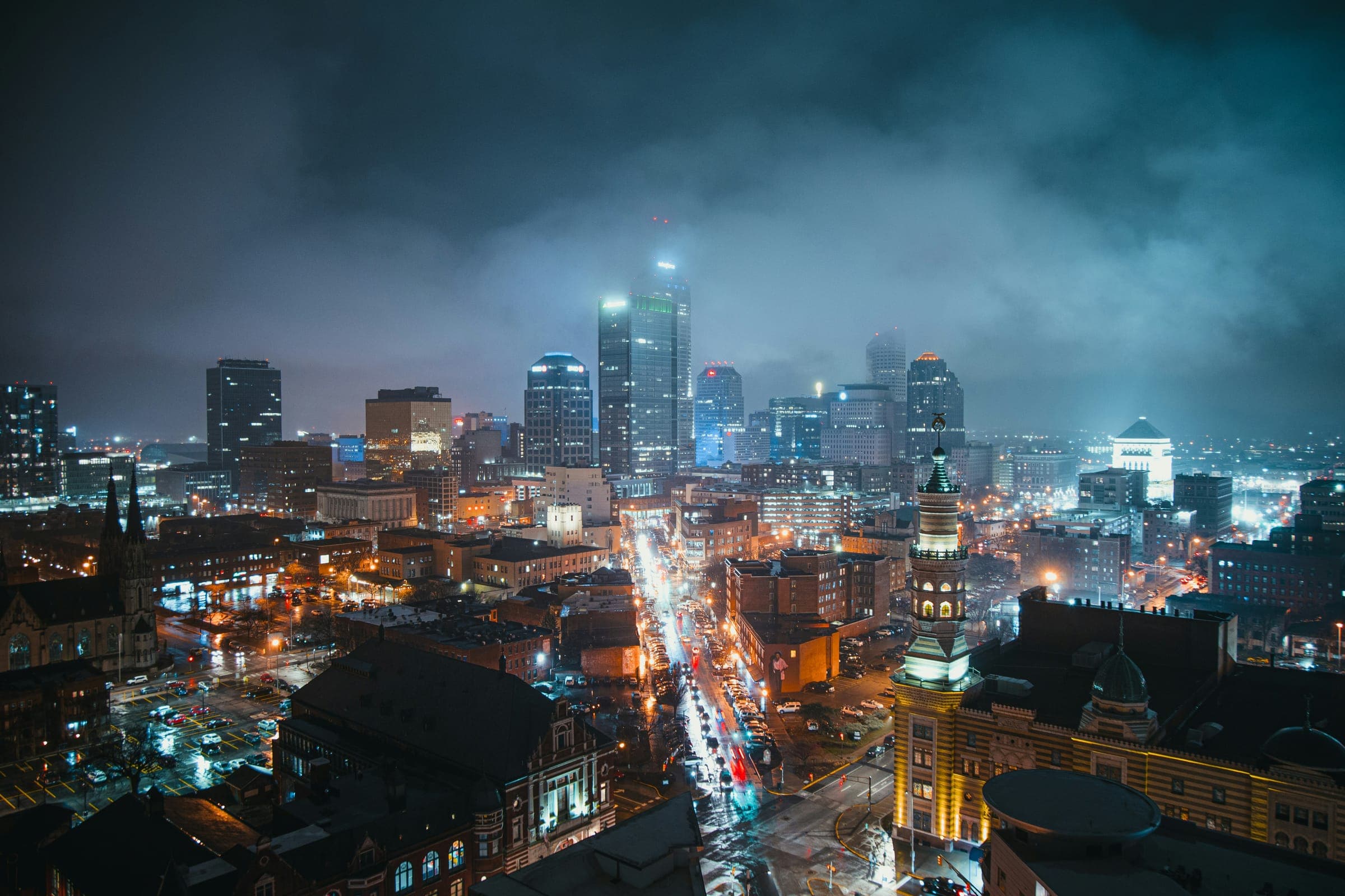 Indianapolis skyline at night under low cloud